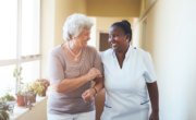caregiver assisting senior woman